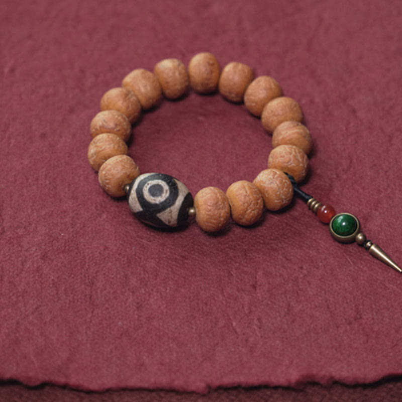 ATELIER-TIBET Bracelet Mala Bodhi 14 mm et Perles Dzi Artisanales La force symbolique des graines sacrées