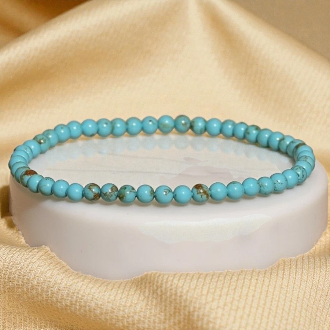 Atelier Tibet fine turquoise beaded bracelet with 4mm natural stones on elastic cord.