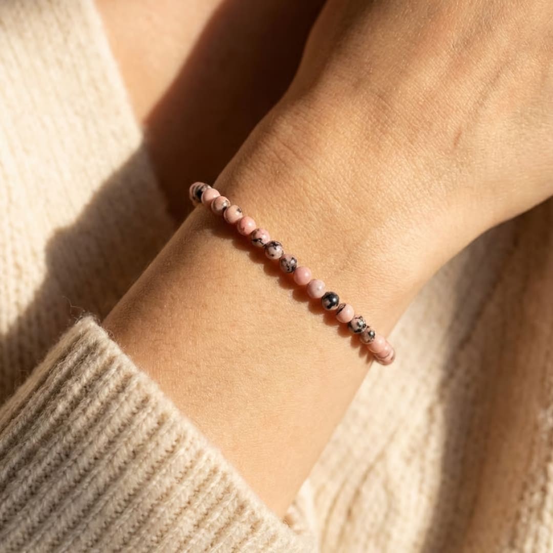 Atelier Tibet delicate pink rhodonite beaded bracelet with black accents, 4mm natural stones on elastic cord.