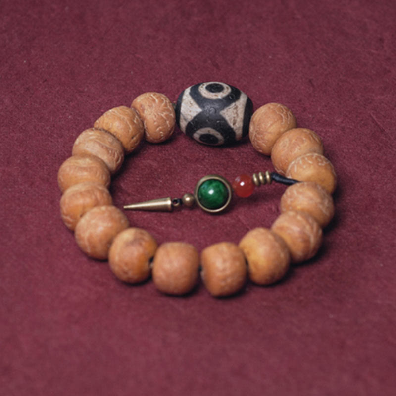 ATELIER-TIBET Bracelet Mala Bodhi 14 mm et Perles Dzi Artisanales La force symbolique des graines sacrées