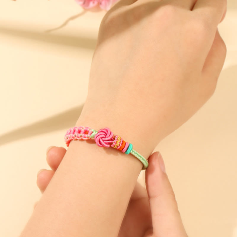 ATELIER-TIBET – Bracelet Fil Rouge Fleur de Pêcher Tressé (Nœud Symbolique)