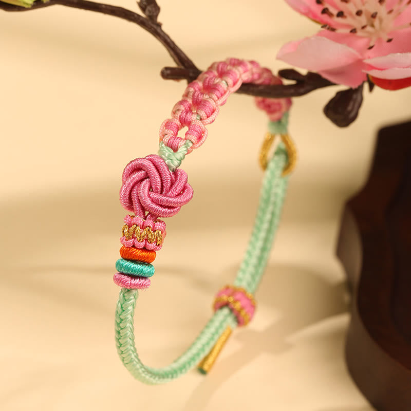 ATELIER-TIBET – Bracelet Fil Rouge Fleur de Pêcher Tressé (Nœud Symbolique)