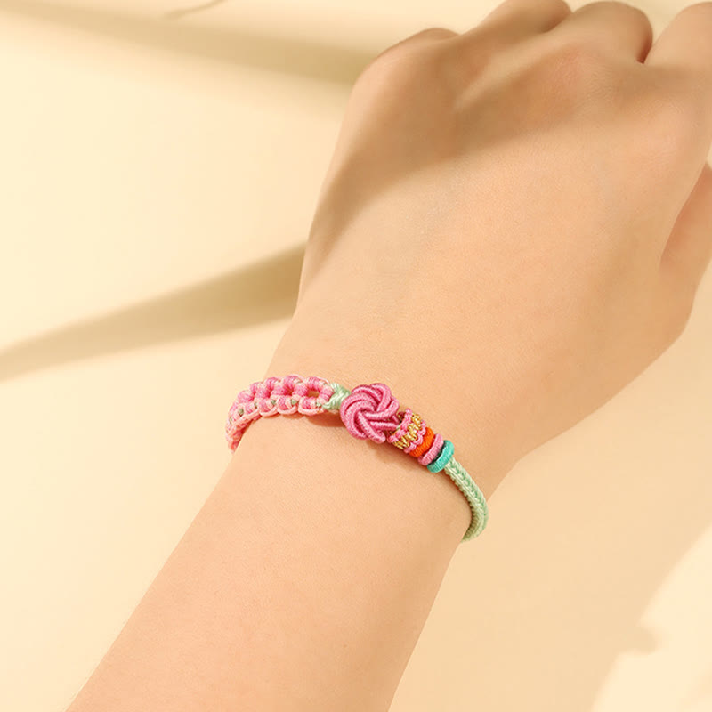 ATELIER-TIBET – Bracelet Fil Rouge Fleur de Pêcher Tressé (Nœud Symbolique)