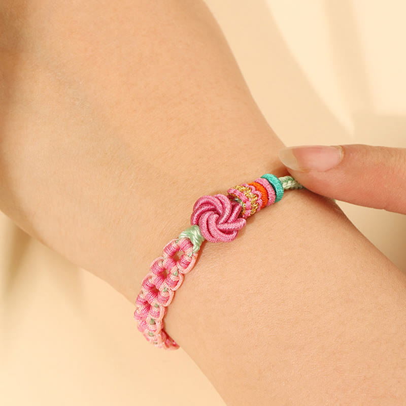 ATELIER-TIBET – Bracelet Fil Rouge Fleur de Pêcher Tressé (Nœud Symbolique)
