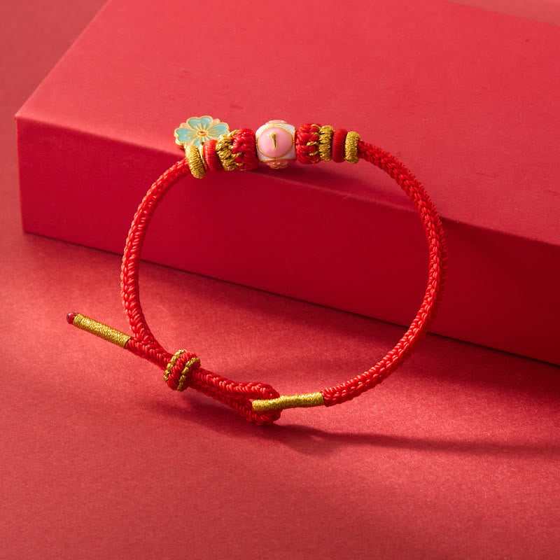 ATELIER-TIBET – Bracelet de Protection Fleur de Pêcher en Cuivre Plaqué Or & Fil Rouge