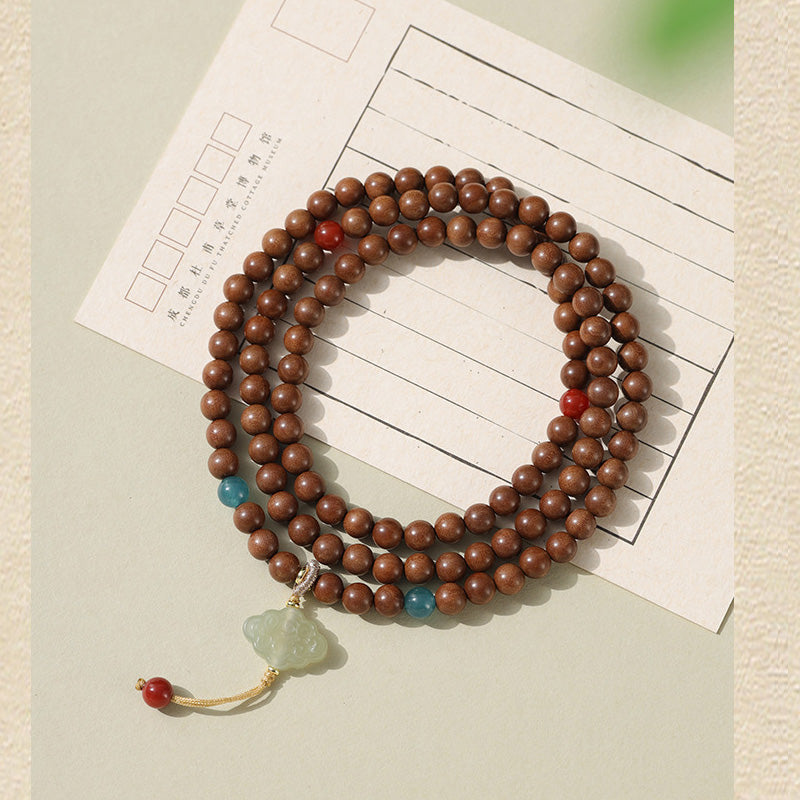 ATELIER-TIBET Bracelet Mala en Bois de Santal Ancien – Symboles Sacrés & Pierres Naturelles