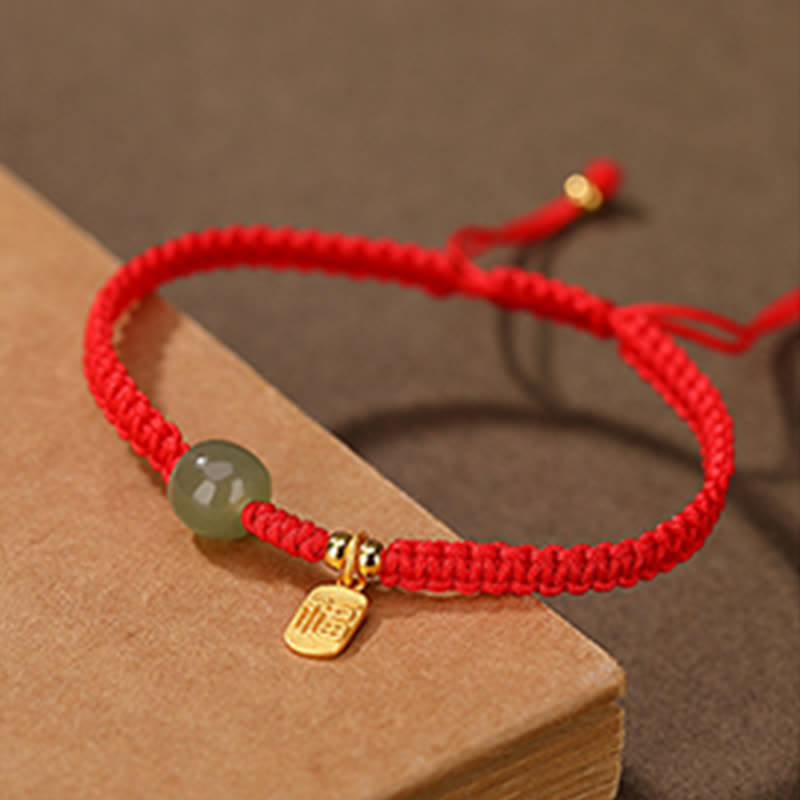 ATELIER-TIBET – Bracelet Ajustable en Jade Hetian Rouge 7 × 8 mm & Fil Tressé