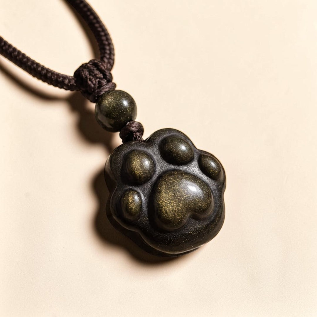 ATELIER-TIBET – Pendentif Patte Lien Éternel en Obsidienne Dorée