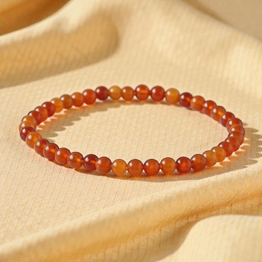 Atelier Tibet fine bracelet with 4mm Carnelian beads, elasticated for a comfortable fit.