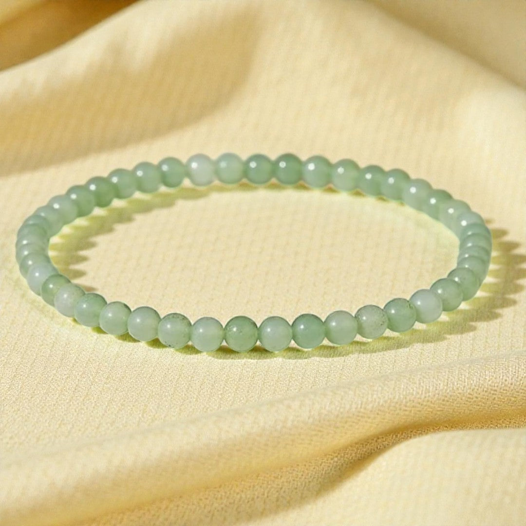 Atelier Tibet delicate green jade beaded bracelet, 4mm natural stone beads on elastic cord.