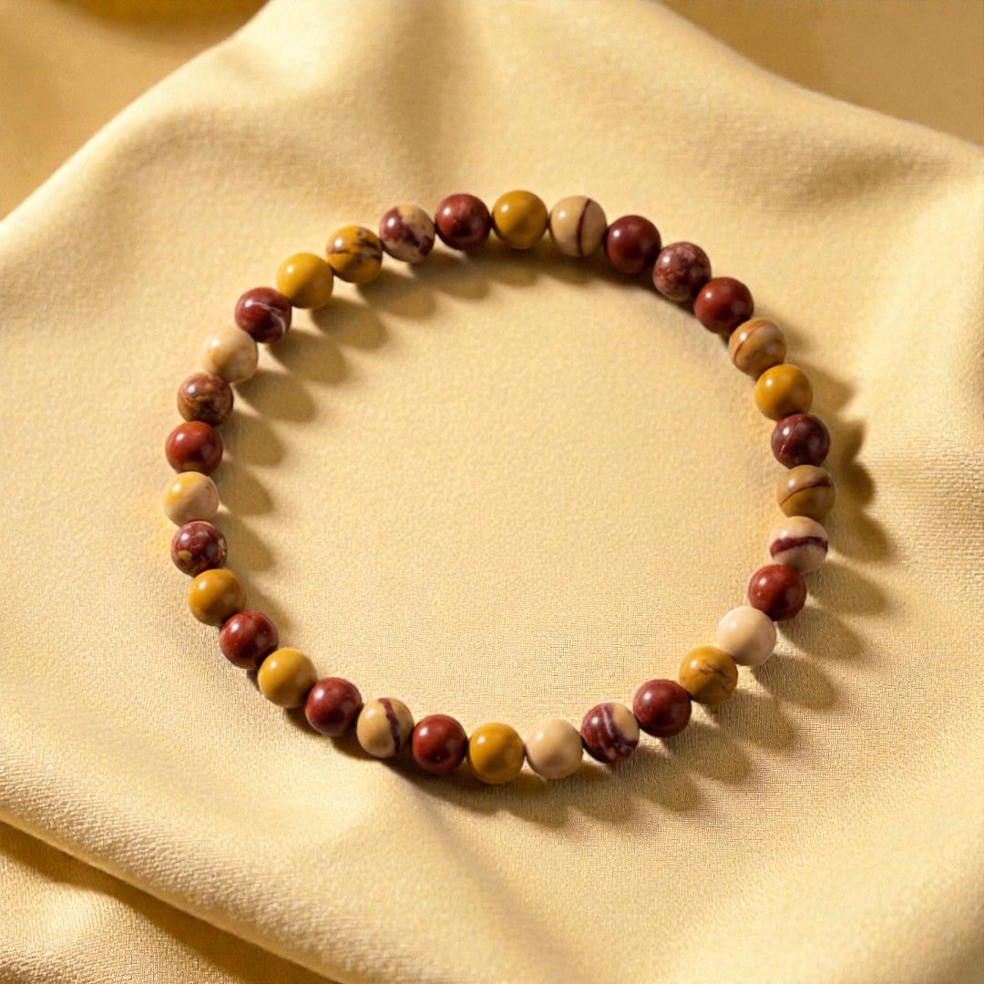 Atelier Tibet fine bracelet with 4mm natural Jasper beads in earthy tones of red, yellow, and cream.