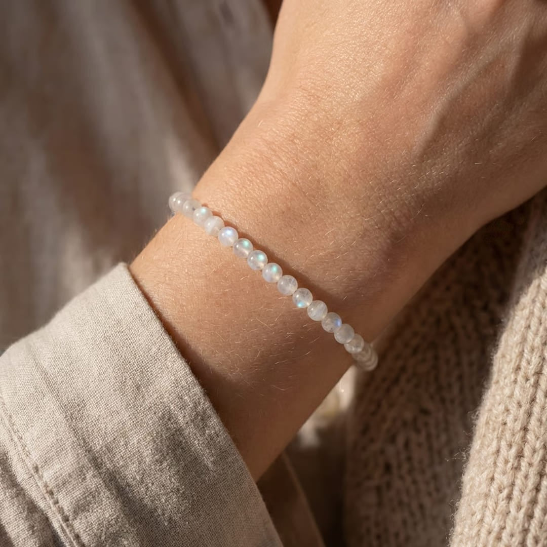 Atelier Tibet fine bracelet with 4mm natural moonstone beads on a wrist, promoting intuition and feminine energy.
