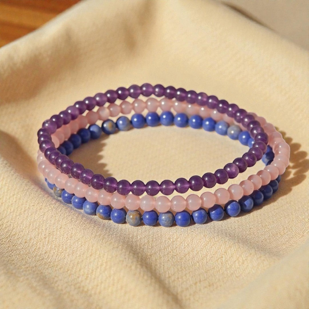 Atelier Tibet stack of 3 fine natural stone bead bracelets in amethyst, rose quartz, and lapis lazuli.