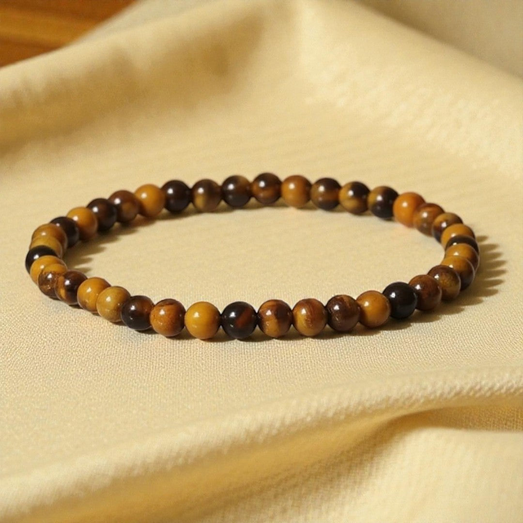 Atelier Tibet fine bracelet with 4mm tiger's eye beads, elasticated for a comfortable fit.